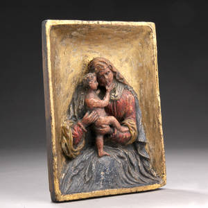 Madonna med barn. Relief af udskåret træ dateret 1862