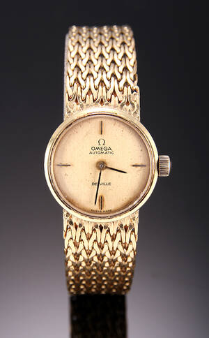 Omega De Ville. Vintage dameur i 18 kt. guld med champagnefarvet skive, ca. 1970