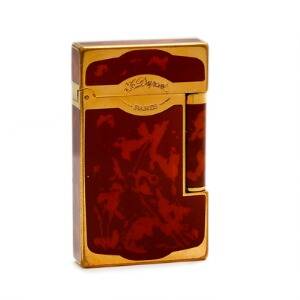 S. T. Dupont Lighter af forgyldt metal prydet med brunmarmoreret lak. L. ca. 6,2 cm. B. ca. 3,7 cm.