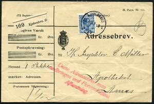 AFA 71 1913. Christian X, 20 Øre, blÃ¥. Adressebrev for 1 pakke pÃ¥ 1½ kg. sendt fra KJØBENHAVN Ø, 25.1.1916 til Apotheket i Asnæs. Rødt 3-linie stempel Dette Adressebrev maa medbringes ved Forsendelsens Afhentning. –º