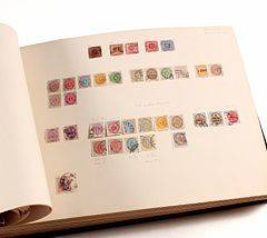 World. 1840-1920. Original and classic OLDTIMER COLLECTION set up in a large home-made leather album. Contains nearly all countries around the world