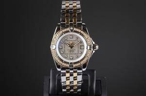 Breitling Cockpit Lady damearmbåndsur af guld og stål, ref. A13356