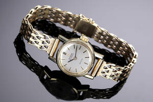 Omega De Ville. Vintage dameur i stål med guldkappe og 14 kt. guldlænke, ca. 1966