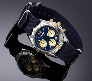 Breitling Windrider. Herrechronograf i 18 kt. guld og stål med blå skive, 1990erne