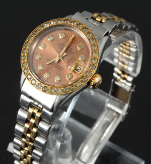 Vintage Rolex Oyster Perpetual Datejust med diamanter og safirer