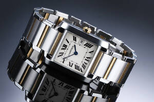 Cartier Tank Francaise. Midsize dameur i 18 kt. guld og stål med lys skive, 2000erne
