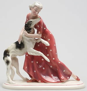 FIGURIN. Porslin. Kvinna med vinthund i Art Deco stil. 1930-tal Katzhutte, Tyskland. Märkt H B.