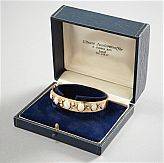 Armring i 18 k guld diamanter