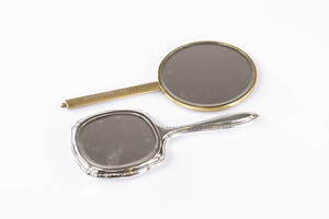 Handspeglar, 2 st, nysilver och mässing, 1900-talets första halva